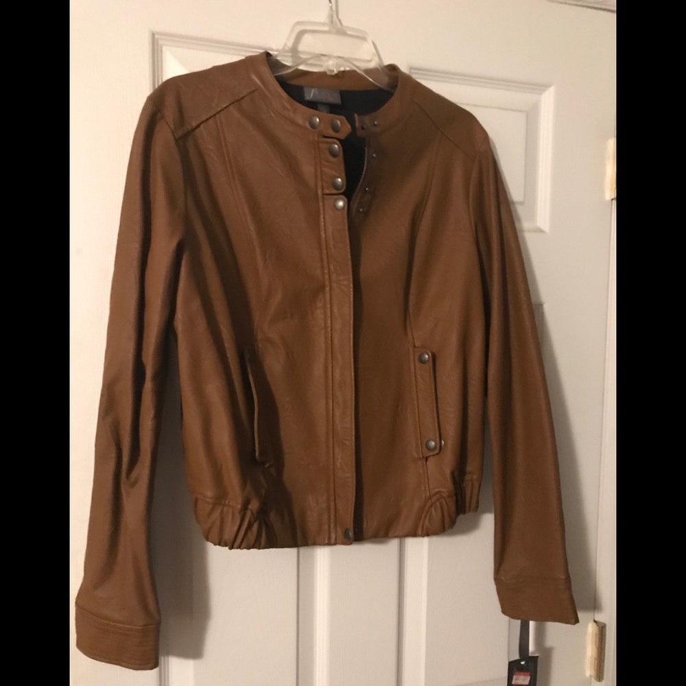 Faux leather.  Banded collar.  Never worn.